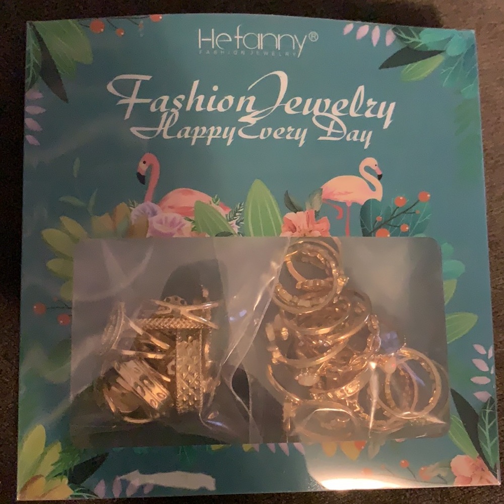 28 various size and design gold colored rings